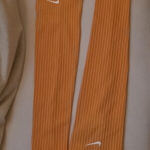 Nike Orange and White Sleeves with White Swoosh Details.